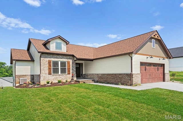 955 Half Moon Ln, Caseyville, IL 62232 - craftsman inspired home featuring an attached garage, driveway, a front yard, and a shingled roof