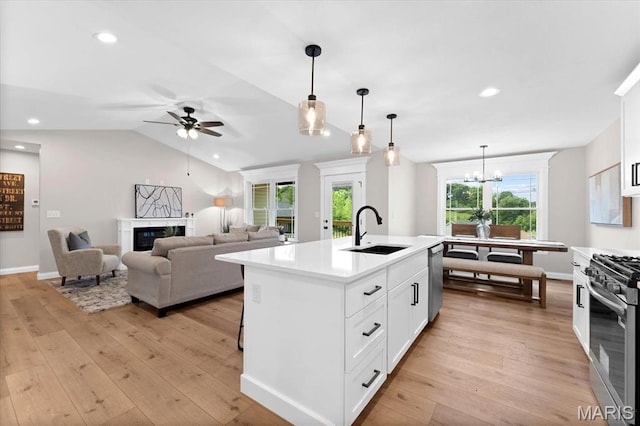 955 Half Moon Ln, Caseyville, IL 62232 - kitchen featuring appliances with stainless steel finishes, a ceiling fan, a chandelier, light countertops, and light wood finished floors
