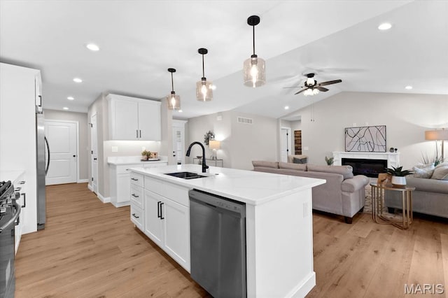 955 Half Moon Ln, Caseyville, IL 62232 - kitchen with stainless steel appliances, ceiling fan, light wood finished floors, open floor plan, and white cabinets