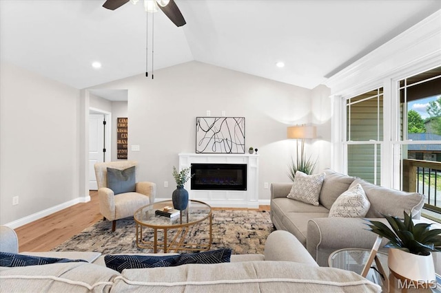 955 Half Moon Ln, Caseyville, IL 62232 - living area with a glass covered fireplace, wood finished floors, lofted ceiling, a ceiling fan, and recessed lighting
