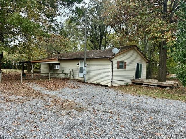 201 County Highway 331, Benton, MO 63736 - view of property exterior featuring a wooden deck and view of scattered trees