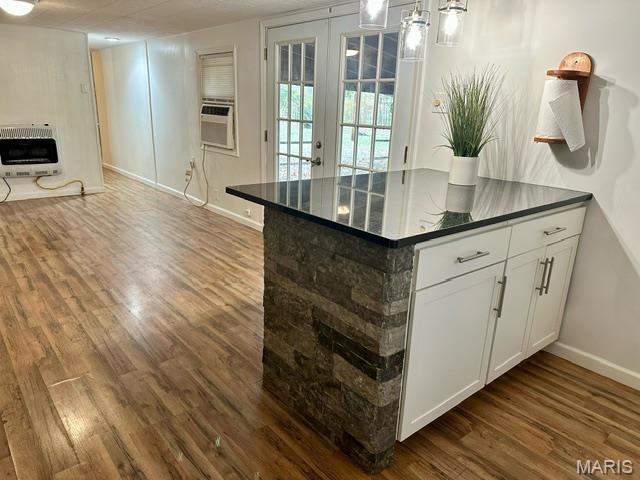 201 County Highway 331, Benton, MO 63736 - kitchen featuring dark countertops, heating unit, dark wood-type flooring, and baseboards