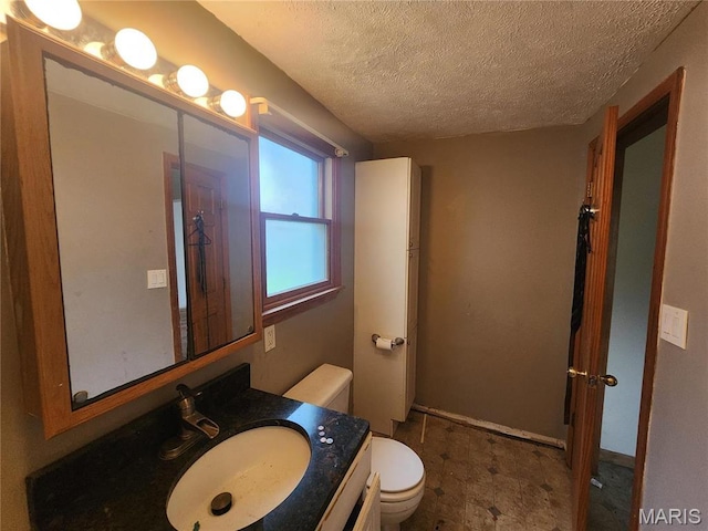 2365 E Converse Ave, Springfield, IL 62702 - bathroom featuring toilet, vanity, and a textured ceiling