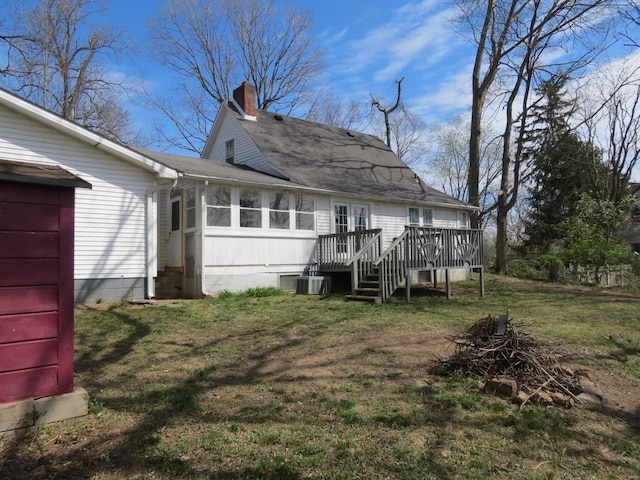 204 E Wayne St, Ironton, MO 63650 - rear view of property with a chimney, a deck, a lawn, central AC, and a shingled roof