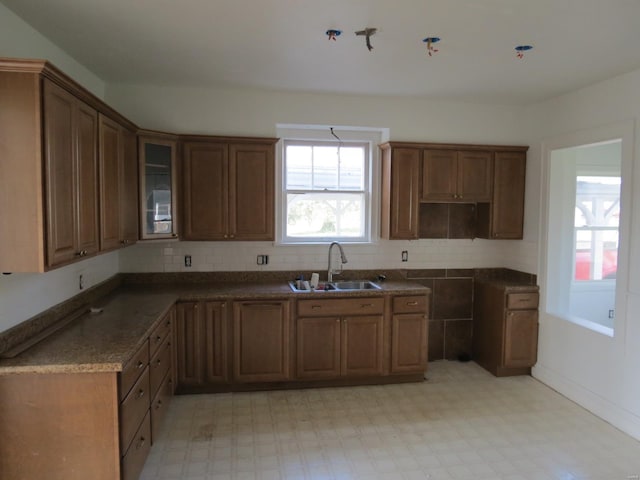 204 E Wayne St, Ironton, MO 63650 - kitchen with a sink, light flooring, tasteful backsplash, and glass insert cabinets