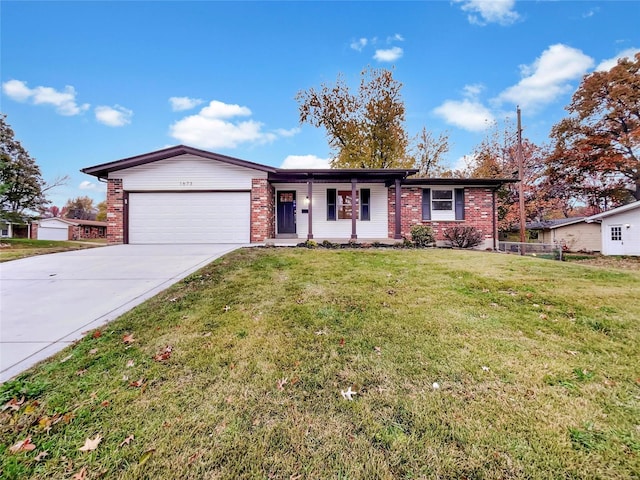 1673 Kingsford Dr, Florissant, MO 63031 - single story home with an attached garage, driveway, brick siding, and a front yard