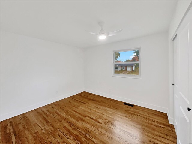 1673 Kingsford Dr, Florissant, MO 63031 - unfurnished bedroom with a closet, wood finished floors, baseboards, and ceiling fan