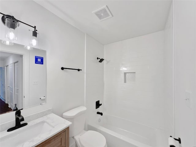 1673 Kingsford Dr, Florissant, MO 63031 - bathroom featuring vanity, toilet, and shower / bathtub combination
