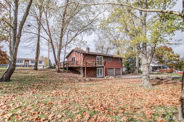 23388 Glenda Ave, Jerseyville, IL 62052 - rear view of house with a garage, a chimney, and a deck