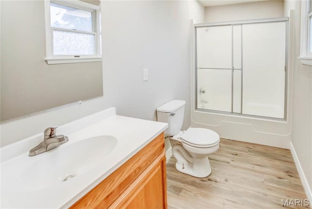 23388 Glenda Ave, Jerseyville, IL 62052 - full bathroom with vanity, wood finished floors, and enclosed tub / shower combo