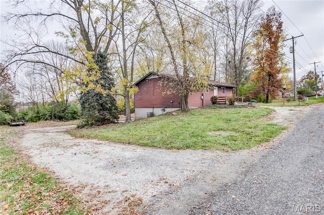23388 Glenda Ave, Jerseyville, IL 62052 - view of home's exterior featuring a yard and gravel driveway