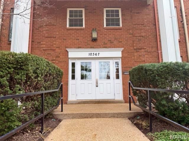 10367 Oxford Hill Dr Unit 26, Saint Louis, MO 63146 - view of exterior entry with brick siding