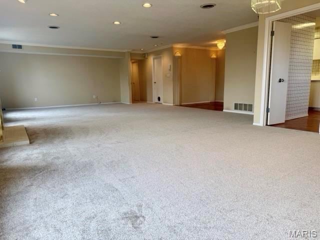 10367 Oxford Hill Dr Unit 26, Saint Louis, MO 63146 - spare room with ornamental molding, baseboards, carpet floors, and recessed lighting