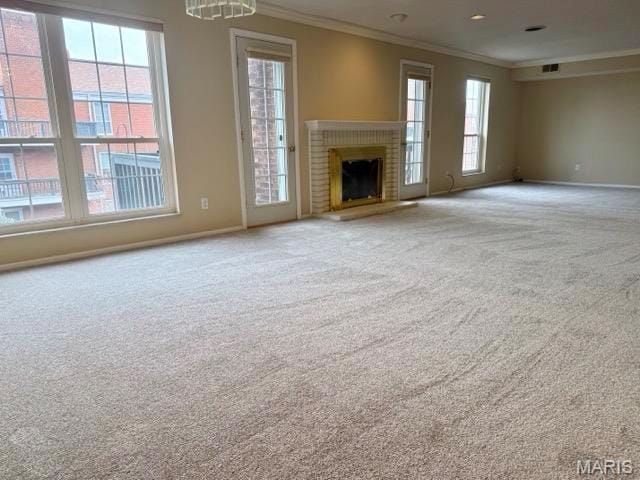 10367 Oxford Hill Dr Unit 26, Saint Louis, MO 63146 - unfurnished living room featuring ornamental molding, carpet flooring, baseboards, and healthy amount of natural light