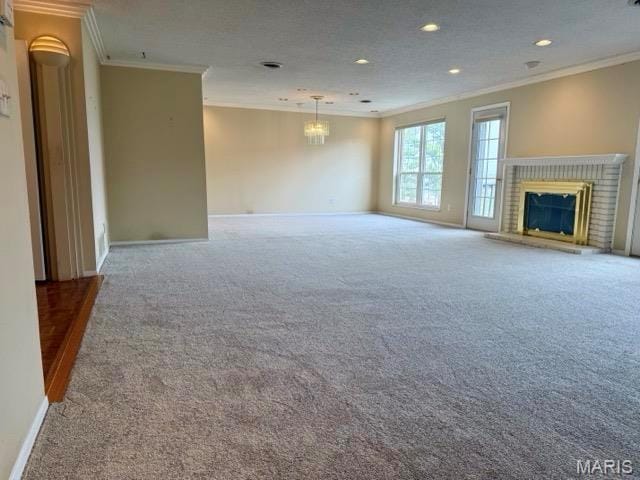 10367 Oxford Hill Dr Unit 26, Saint Louis, MO 63146 - unfurnished living room with crown molding, carpet, a fireplace, baseboards, and recessed lighting