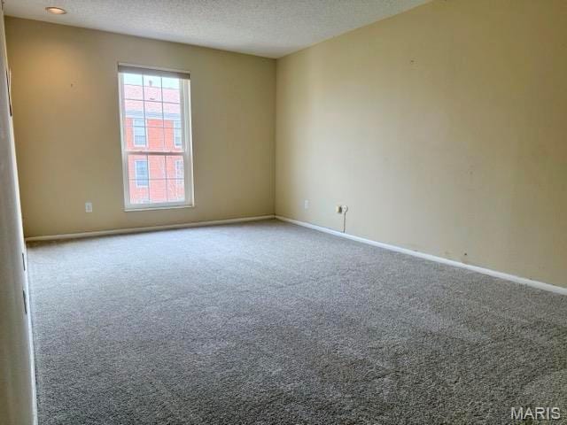 10367 Oxford Hill Dr Unit 26, Saint Louis, MO 63146 - empty room with carpet flooring, baseboards, and a textured ceiling