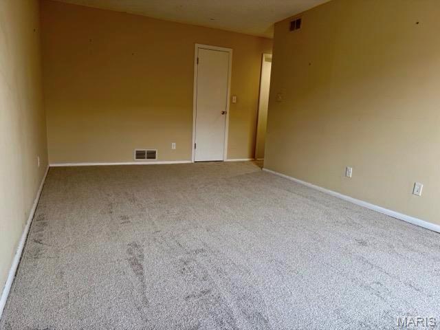 10367 Oxford Hill Dr Unit 26, Saint Louis, MO 63146 - carpeted spare room with baseboards