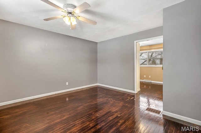 803 Fairview Dr, Washington, MO 63090 - spare room featuring hardwood / wood-style flooring, a ceiling fan, and baseboards