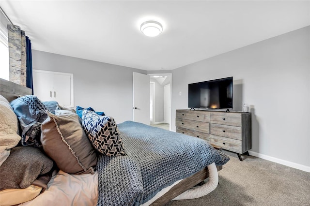 bedroom featuring carpet flooring and baseboards