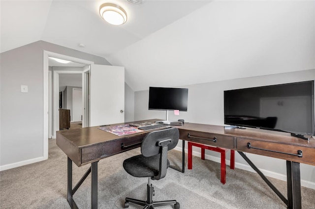 home office with carpet flooring, vaulted ceiling, and baseboards