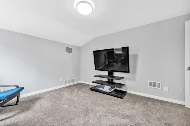 home theater room with vaulted ceiling, baseboards, and carpet flooring