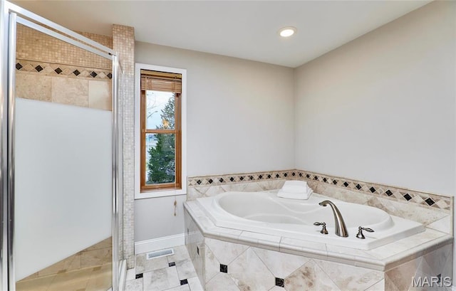 bathroom featuring a shower stall, a garden tub, tile patterned floors, and recessed lighting