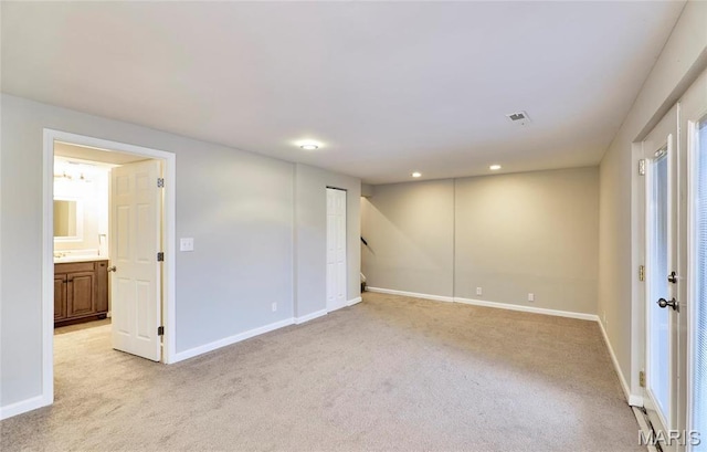 basement with light colored carpet, baseboards, and recessed lighting