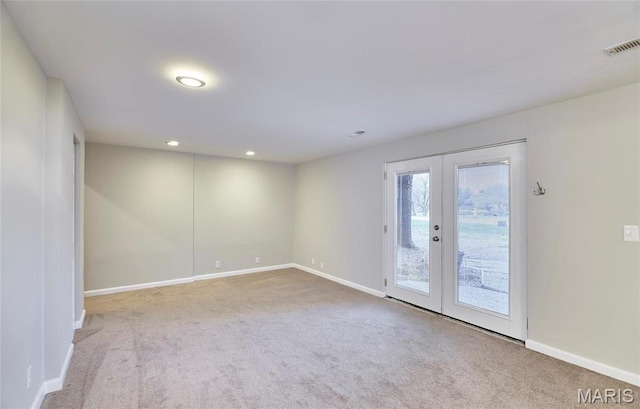 unfurnished room featuring carpet flooring, french doors, baseboards, and recessed lighting