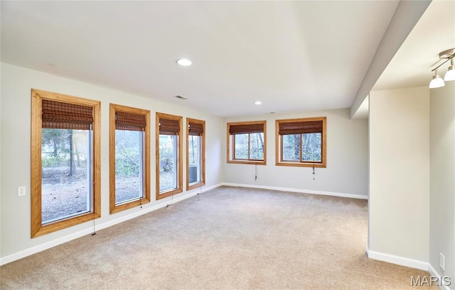 carpeted spare room with baseboards and recessed lighting