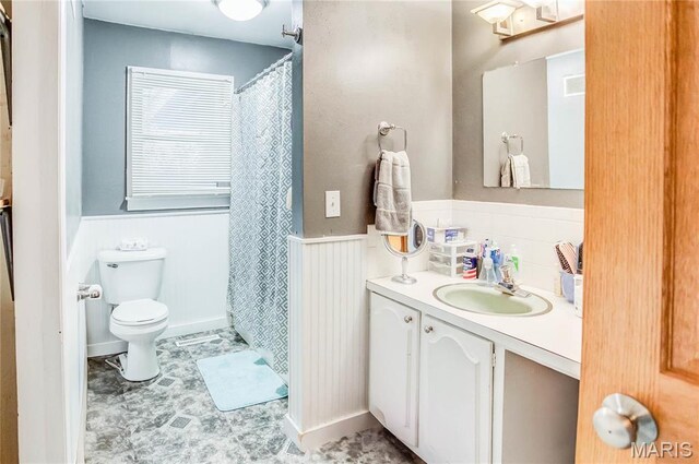 121 Douglas Dr, Pleasant Hill, IL 62366 - bathroom with a wainscoted wall, toilet, vanity, and curtained shower