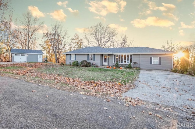 121 Douglas Dr, Pleasant Hill, IL 62366 - ranch-style house featuring asphalt driveway, an outbuilding, and a front lawn