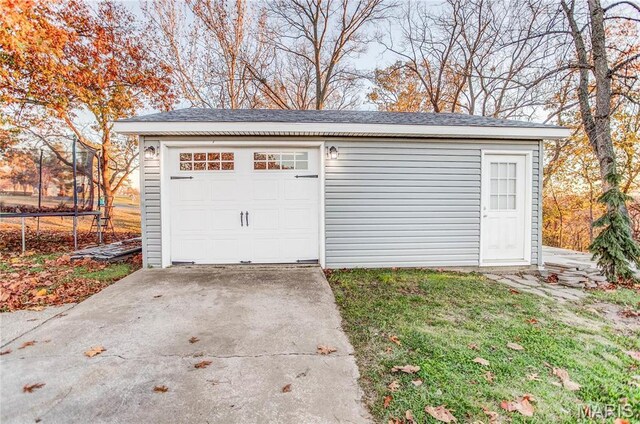 121 Douglas Dr, Pleasant Hill, IL 62366 - detached garage featuring a trampoline and concrete driveway