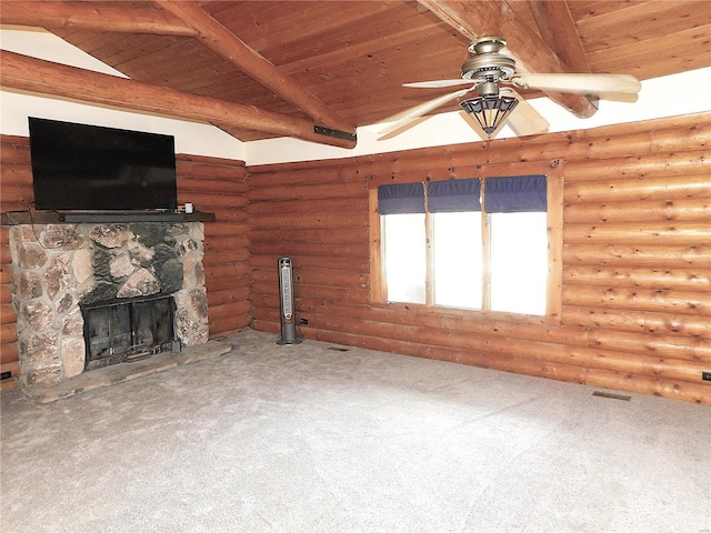 unfurnished living room featuring wooden ceiling, beamed ceiling, a fireplace, a ceiling fan, and carpet