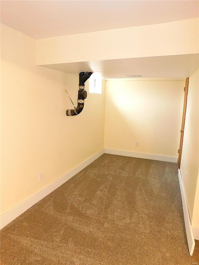 basement with carpet flooring and baseboards