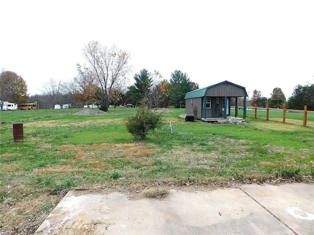 view of yard with a storage unit and an outbuilding