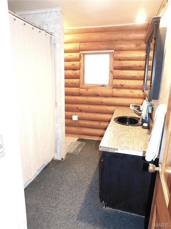 5 Sherwood Meadows Cir, Marthasville, MO 63357 - bathroom featuring a sink, log walls, and a shower with curtain