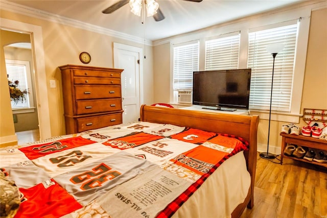 1040 N Kingshighway, Sikeston, MO 63801 - bedroom with wood finished floors, ornamental molding, baseboards, and a ceiling fan