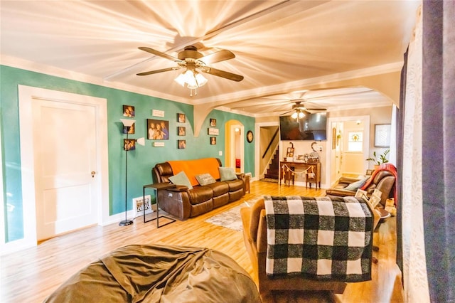 1040 N Kingshighway, Sikeston, MO 63801 - living room with arched walkways, stairs, a ceiling fan, wood finished floors, and ornamental molding