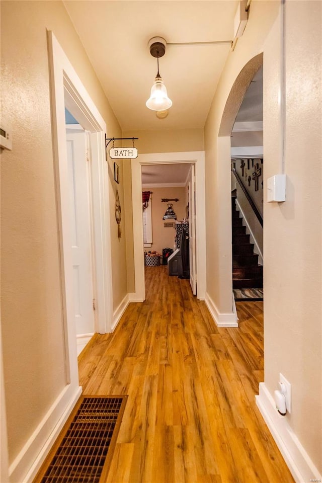 1040 N Kingshighway, Sikeston, MO 63801 - corridor with arched walkways, light wood-style floors, baseboards, and stairway