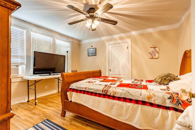 1040 N Kingshighway, Sikeston, MO 63801 - bedroom featuring crown molding, wood finished floors, and a ceiling fan
