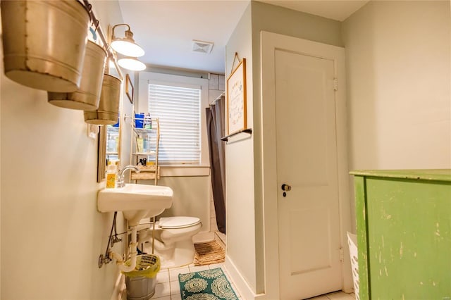 1040 N Kingshighway, Sikeston, MO 63801 - bathroom with tile patterned flooring, a stall shower, toilet, and baseboards