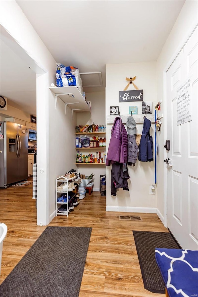 1040 N Kingshighway, Sikeston, MO 63801 - mudroom featuring wood finished floors and baseboards