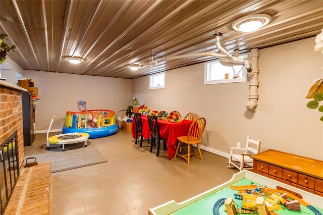 1040 N Kingshighway, Sikeston, MO 63801 - recreation room with concrete floors, a fireplace, and baseboards