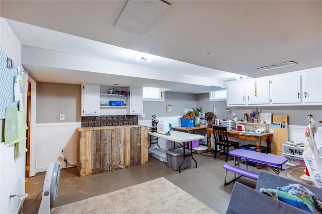 1040 N Kingshighway, Sikeston, MO 63801 - kitchen with concrete floors, white cabinetry, and open shelves