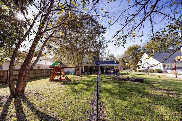 1040 N Kingshighway, Sikeston, MO 63801 - view of yard with a playground and a detached carport