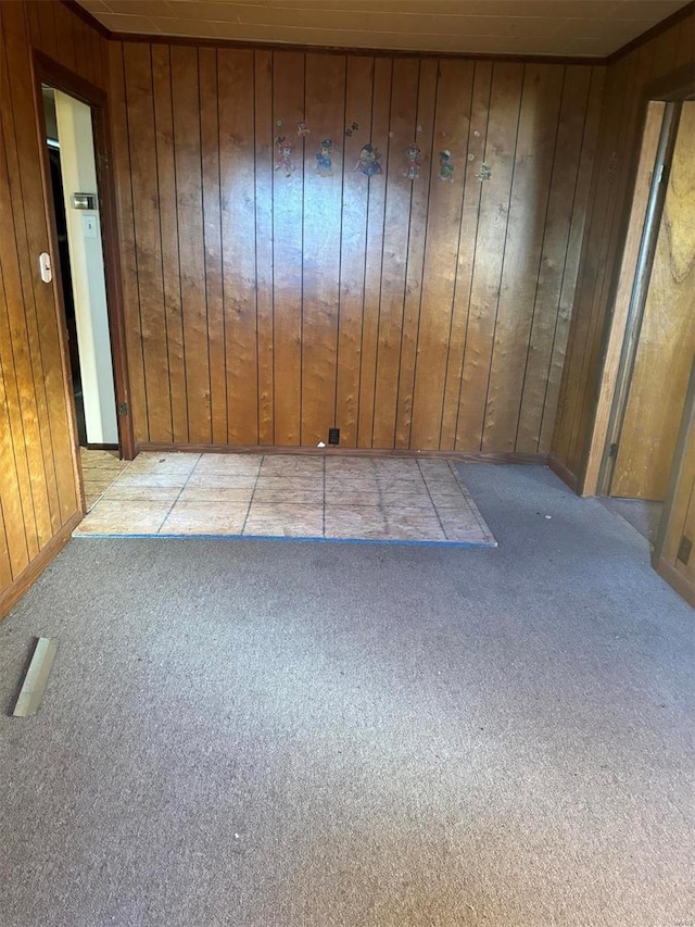 206 Chance St, Kennett, MO 63857 - carpeted spare room featuring wooden walls