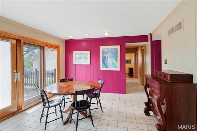 dining room with crown molding, light tile patterned flooring, and recessed lighting