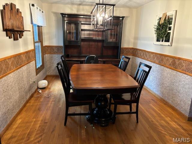 15020 Jamestown Rd, Breese, IL 62230 - dining area with tile walls, wainscoting, a chandelier, and wood finished floors