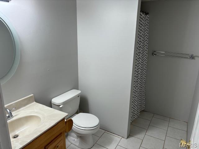 15020 Jamestown Rd, Breese, IL 62230 - full bathroom featuring vanity, toilet, tile patterned floors, and a shower with curtain