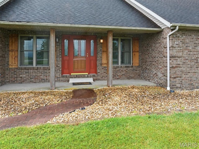 15020 Jamestown Rd, Breese, IL 62230 - property entrance featuring a shingled roof, brick siding, and a porch